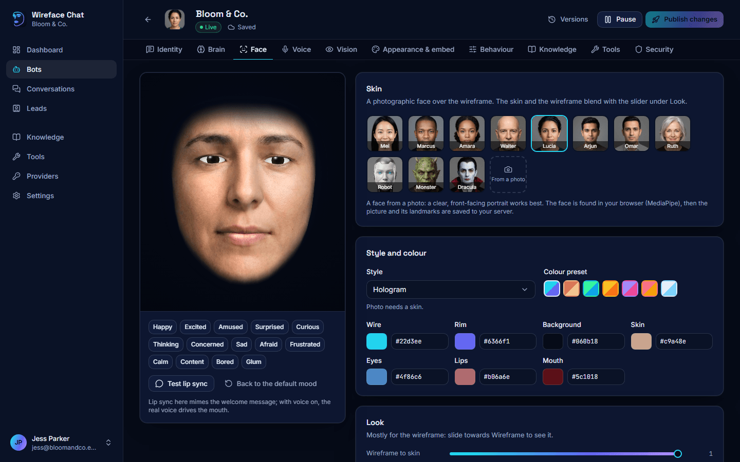 The Face tab: a live face with mood buttons and Test lip sync on the left, and the skin gallery and colour settings on the right